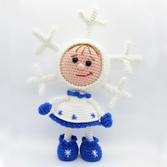 Doll in a snowflake outfit